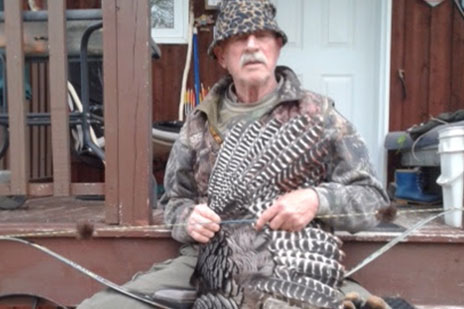 Hunter with dead turkey